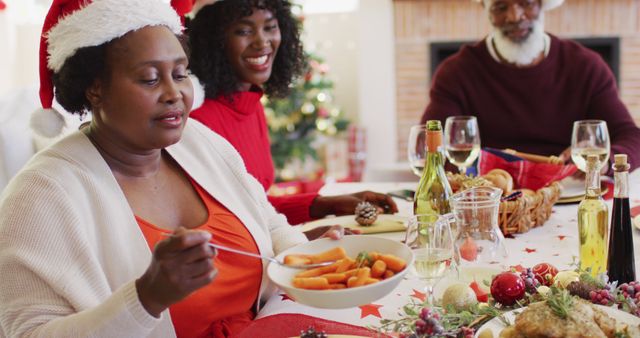 Family Enjoying Christmas Dinner Together at Festive Table - Download Free Stock Images Pikwizard.com