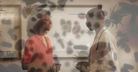 Doctor and Nurse Discussing Covid-19 Amid Digital Virus Overlay