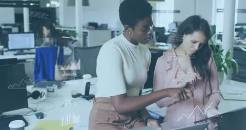 Women Collaborating on Data Analysis with Digital Charts