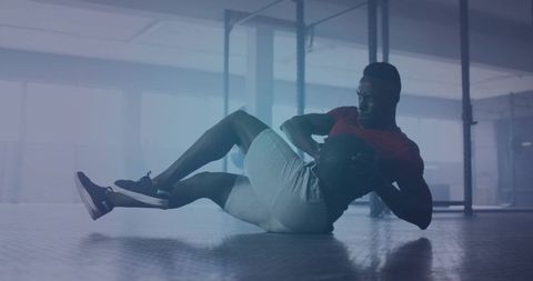 Athlete Engaging in Dynamic Medicine Ball Workout in Modern Gym