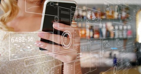 Businessperson Analyzing Data on Smartphone in Modern Office