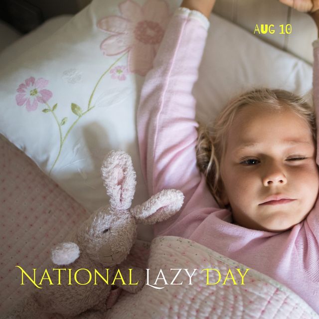 Young girl stretching comfortably in bed while celebrating National Lazy Day on August 10. Perfect for use in blogs or articles about relaxation, national days observance, children's routines, or promoting the importance of leisure and rest. Can also be used in marketing for bedding, sleepwear, or children's products.