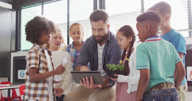 Teacher Interacting with Students on Tablet in a Classroom - Download Free Stock Images Pikwizard.com