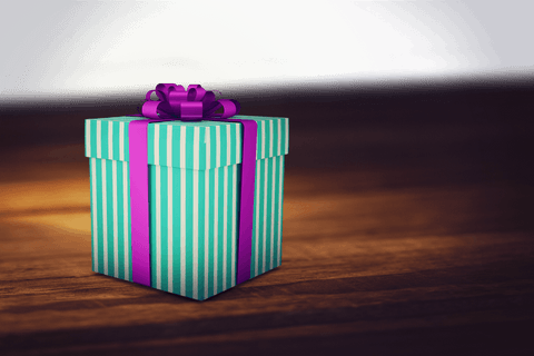 Colorful striped gift box with bow on transparent background