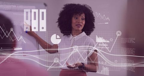 Confident Businesswoman Presenting Data Charts in Modern Office - Download Free Stock Images Pikwizard.com