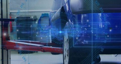 Vehicle wheel undergoing digital diagnostics with hud overlay in automotive repair garage