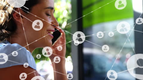 Businesswoman Communicating via Smartphone in Connected Network