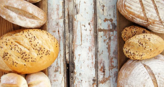 Variety of Freshly Baked Artisan Bread on Rustic Wooden Table - Download Free Stock Images Pikwizard.com