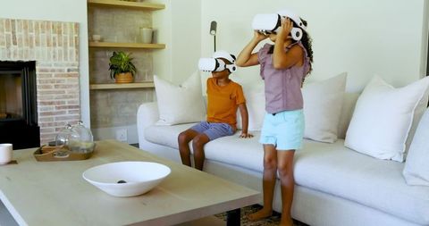 Children Experiencing Virtual Reality Together in Cozy Living Room