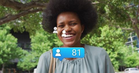 Woman at Urban Park Receiving Social Media Notifications
