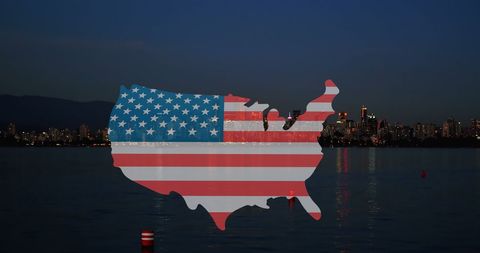 USA Map with Flag Overlay on Night Cityscape Representing Patriotism