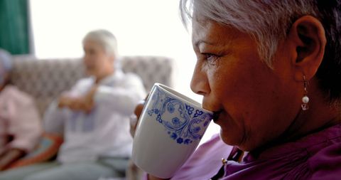Senior Woman Enjoying Coffee with Friends in Nursing Home - Download Free Stock Images Pikwizard.com