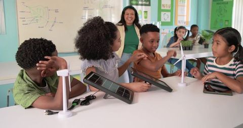Elementary students building solar and wind energy projects during hands-on stem lesson