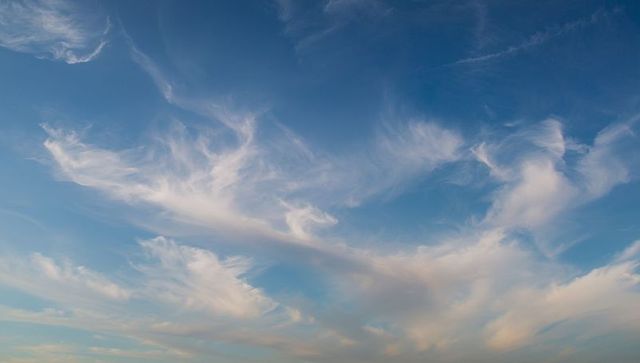 Serenity in Ethereal Cirrus Clouds Against Blue Sky
