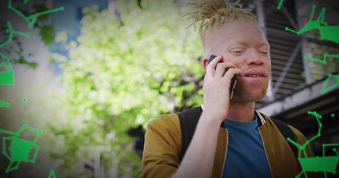 Young man with dreadlocks talking on smartphone in urban park with green graphic overlay