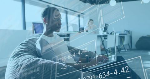 Woman Exploring Digital Interface in Modern Office Environment