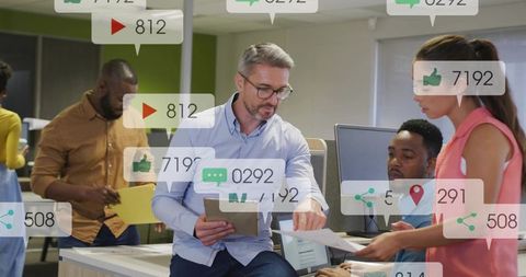 Manager Reviewing Social Media Analytics with Team Collaborating at Modern Office Desk