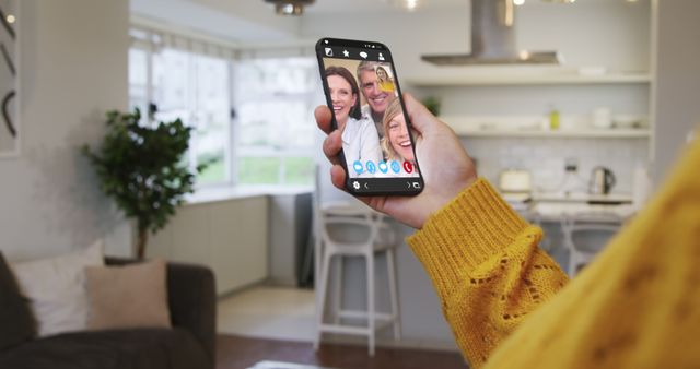 Person Making Video Call with Family in Modern Kitchen - Download Free Stock Images Pikwizard.com