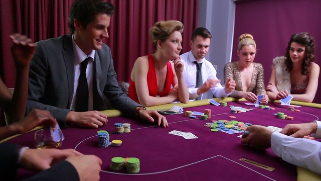 Group of players surrounding poker table, engaged in an intense game, focusing on actions and strategy. Setting signifies entertainment and chance, perfect to illustrate themes of casino activities and social interactions. Ideal for use in promotions of gambling, nightlife services, and entertainment events.