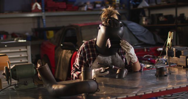 Female Welder Working in Industrial Workshop, Focusing on Craftsmanship - Download Free Stock Images Pikwizard.com