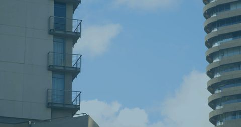 Architectural Elegance of Modern Buildings Against Blue Sky - Download Free Stock Images Pikwizard.com