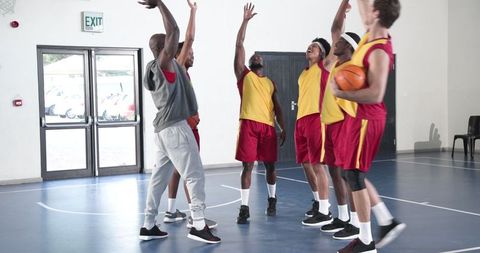Diverse Team Celebrating Victory on Basketball Court