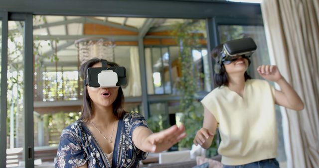 Young Women Enjoying Virtual Reality Experience at Home - Download Free Stock Images Pikwizard.com