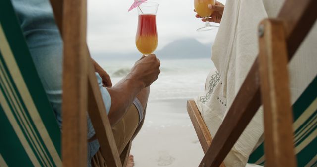 Couple Relaxing on Beach Loungers with Tropical Drinks - Download Free Stock Images Pikwizard.com