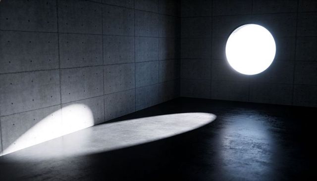 Circular Aperture Casting Elliptical Light on Minimal Concrete Corner with Dramatic Shadows
