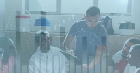 Coach Discussing Strategy with Football Team Amidst Statistical Display