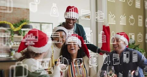 Coworkers Laughing and Toasting at Office Holiday Party in Santa Hats with Digital Icons