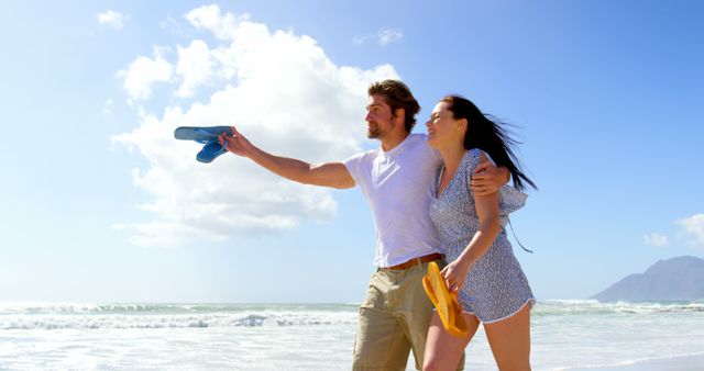 Couple Having Fun Walking on Beach Holding Sandals - Download Free Stock Images Pikwizard.com