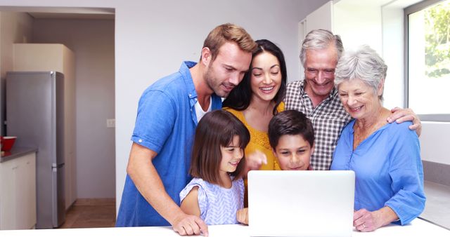 Multi-Generational Family Gathering Around Laptop in Kitchen - Download Free Stock Images Pikwizard.com