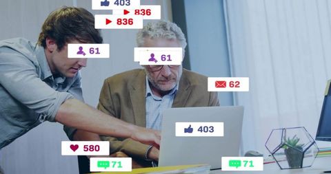 Mentor guiding colleague on laptop with social media notification overlays and teamwork focus