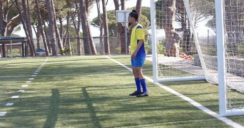 Soccer Player Concentrating in Front of Goal