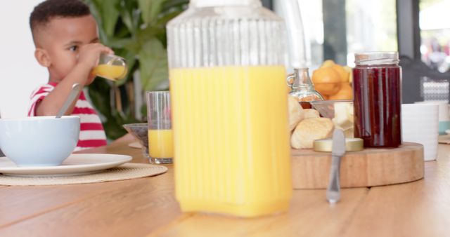 Child Enjoying Fresh Orange Juice During Breakfast - Download Free Stock Images Pikwizard.com