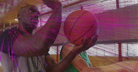 Coach mentoring young athlete in basketball shooting technique
