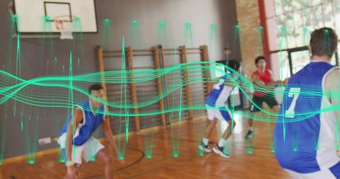 Indoor basketball team defending on court with futuristic data wave overlay for training
