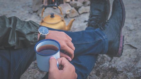 Outdoor Relaxation with Coffee Mug and Vintage Teapot