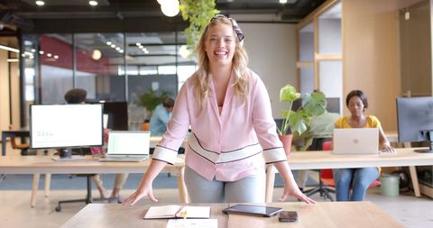Confident Businesswoman Smiling in Cheerful Modern Office - Download Free Stock Images Pikwizard.com
