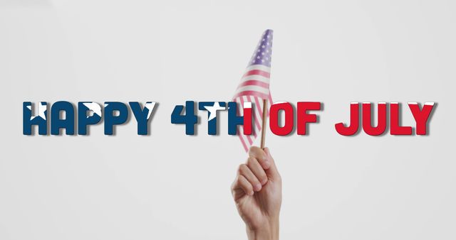 Image of happy 4th of july text and hand holding flag of america on white background. America, independence day, celebration, tradition, holiday and patriotism concept digitally generated image.
