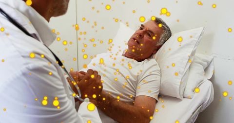 Clinician listening to senior patient at bedside with stethoscope and particle overlay