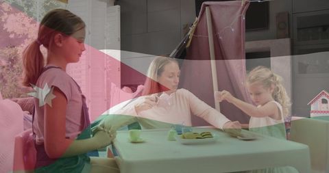 Mother and Daughters Enjoy Playful Tea Party at Home