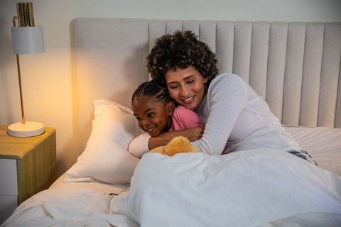 Mother and Daughter Sharing a Warm Embrace at Bedtime
