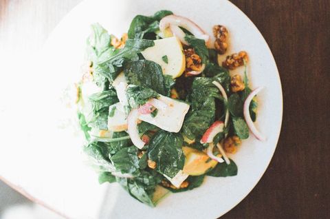 Bright spinach apple salad with walnuts, goat cheese, red onion and vinaigrette