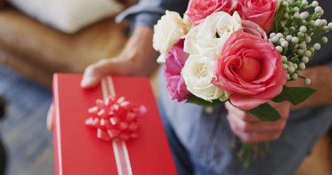 Man Offering Red Gift Box and Pink Rose Bouquet Close-Up - Download Free Stock Images Pikwizard.com