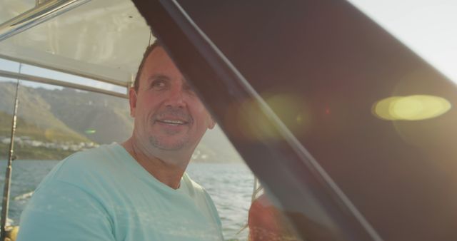 Middle-aged man enjoying boat ride under sunny sky - Download Free Stock Images Pikwizard.com
