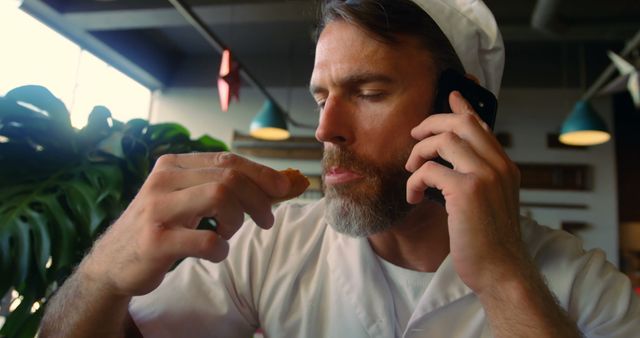 Chef Tasting Food While Talking on Phone - Download Free Stock Images Pikwizard.com