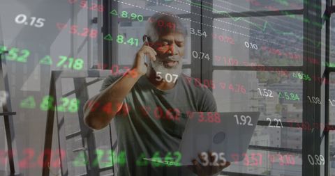 Elderly black man analyzing stock market data