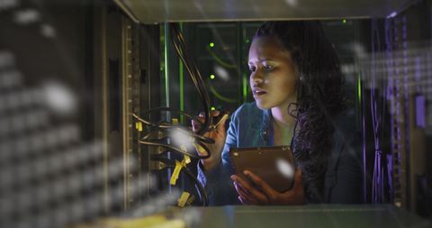 African American Businesswoman Strategizing in Data Server Room